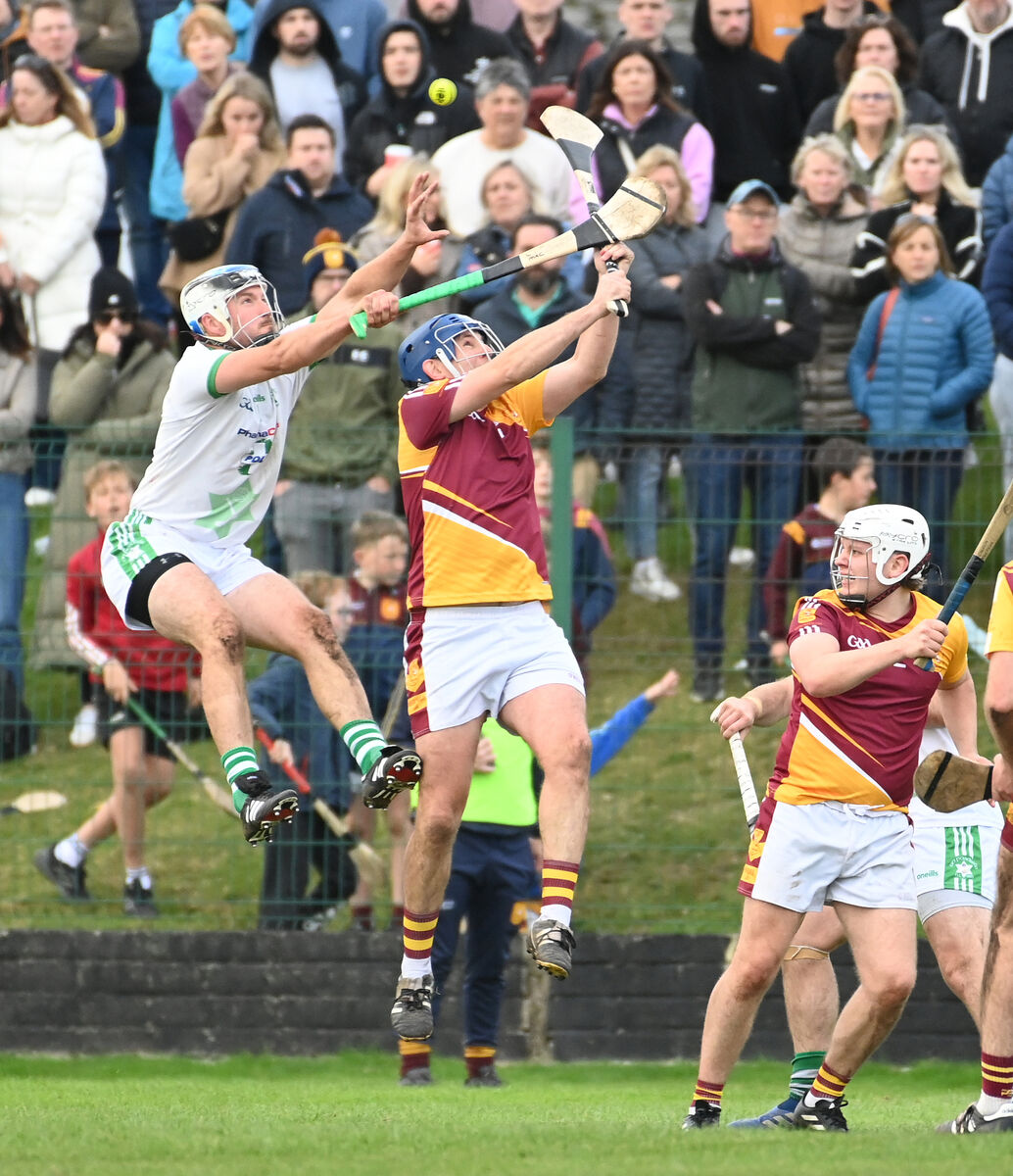 Passage's Cian McCarthy (son of the late Teddy McCarthy) goes high with Whitechurch's Bryan O'Sullivan during the AOS Security JAHC final at Ballinlough. Picture: Eddie O'Hare