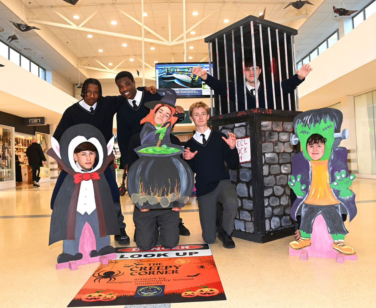 Douglas Community School students Ahmed Algameel, Sadiq Alhadi (rear) and (in jail) is Elijah Kerrigan with (front) Daniel Volkovs, Bobby Heffernan, Rian O'Donaile and Liam Daly bringing a scare to customers. Douglas Community School students Ahmed Algameel, Sadiq Alhadi (rear) and (in jail) is Elijah Kerrigan with (front) Daniel Volkovs, Bobby Heffernan, Rian O'Donaile and Liam Daly bringing a scare to customers.