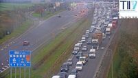 M1 traffic: Drivers face long delays after lorry overturns on motorway