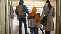 Happy family on train station