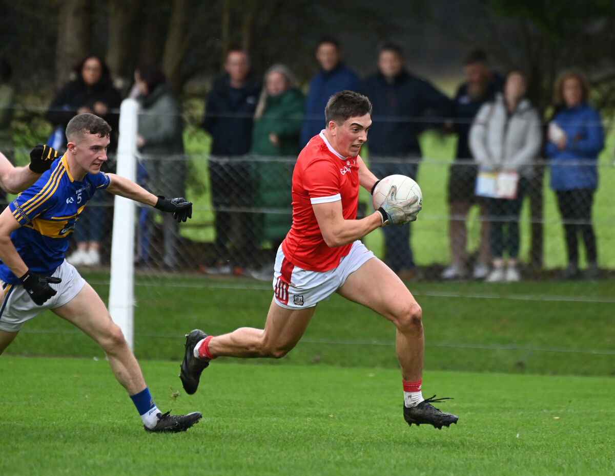  Ciaran Joyce, Castlemartyr is chased by Adam Rooney, Carrigtwohill. Picture: Larry Cummins