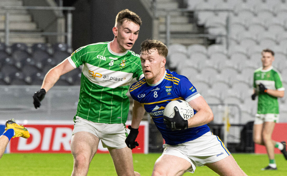 Kilshannig's Bill Curtin attempts to get past Aghabullogue's Colm Gillespie. Picture: Howard Crowdy