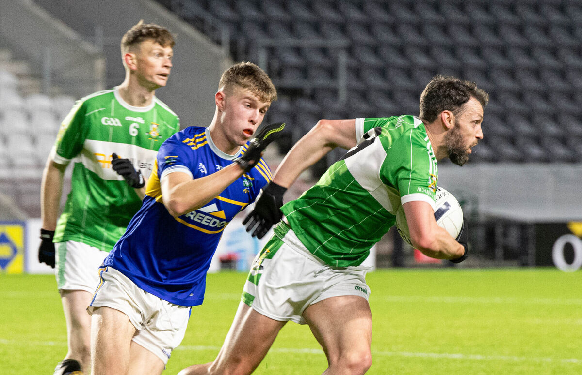 Aghabullogue's Dhani Merrick pulls away from Kilshannig's Alan O'Connell. Picture: Howard Crowdy