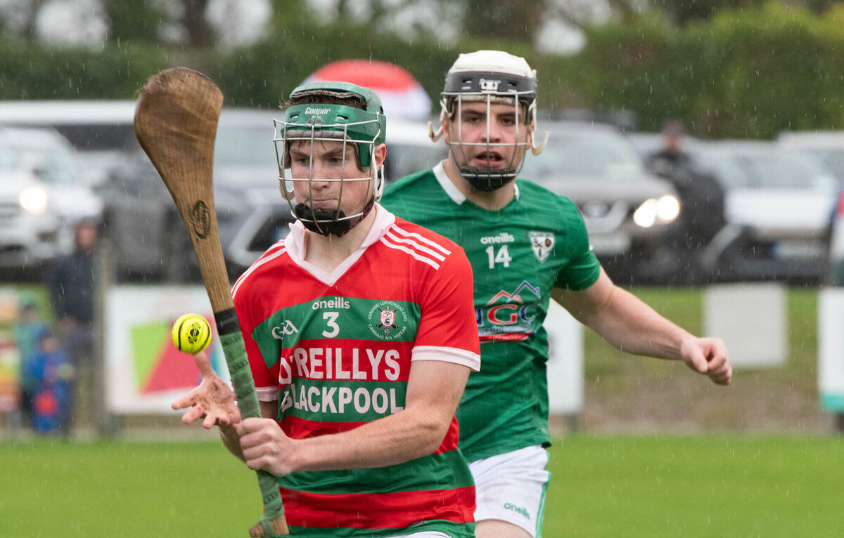Felix Murphy of Carraig Na bhFear about to clear the sliotar upfield ahead of Killeagh's Barry Walsh. Picture: Howard Crowdy