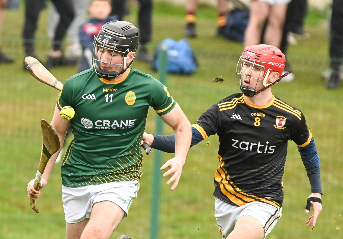 Blackrock's Vaughan Ryan tries to get away from Na Piarsaigh's Sean Downey, during their U21 A Hurling Championship quarter-final at Ballinlough.