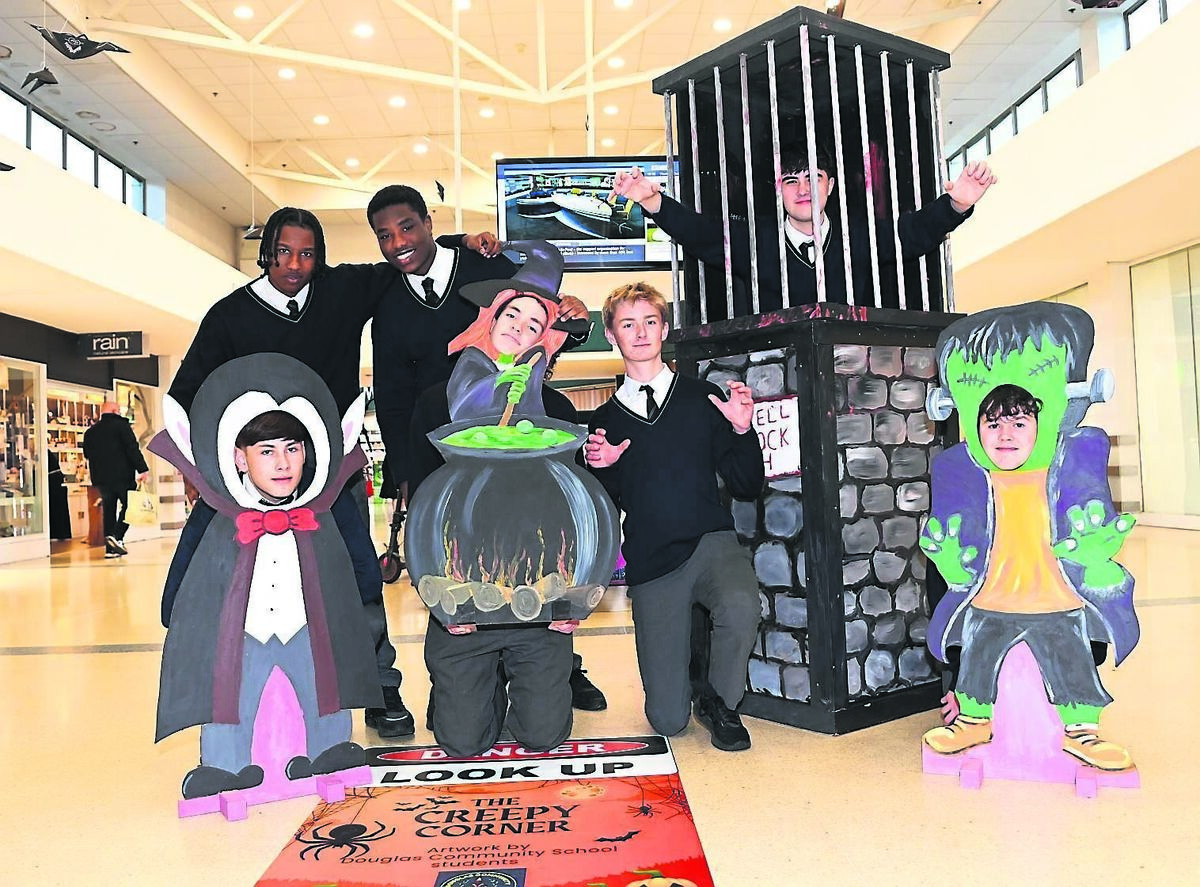 Ahmed Algameel, Sadiq Alhadi, and (in jail) is Elijah Kerrigan with (front) Daniel Volkovs, Bobby Heffernan, Rian O’Donaile and Liam Daly bringing a scare to customers as TY students from Douglas Community School as Halloween items created by the school are on display as part of the Hallowe’en celebrations at Douglas Court Shopping Centre.	Picture: Larry Cummins
                    