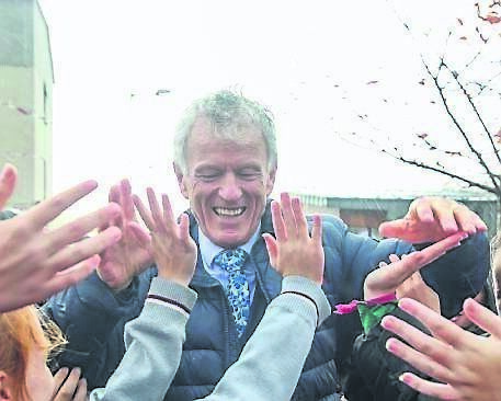 Principal Gabriel Ó Cathasaigh says goodbye to pupils, who formed a guard of honour, after Principal Gabriel Ó Cathasaigh says goodbye to pupils, who formed a guard of honour, after