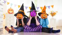 Kids in witch costume on Halloween trick or treat