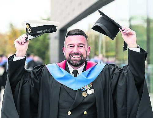 Two hats! John Patterson from Carrigaline, wearing his graduation hat and Irish Naval hat, celebrating his Bachelor of Arts in Leadership, Management, and Naval Studies at MTU Bishopstown Campus.	Picture: Joleen Cronin
                    