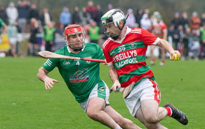 Carraig na bhFear's Sean O'Donoghue attempts to break away from Killeagh's Padraig Leahy. Picture: Howard Crowdy