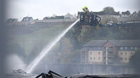 Fire crews continue to dampen hot spots following fire at commercial building on Cork's northside