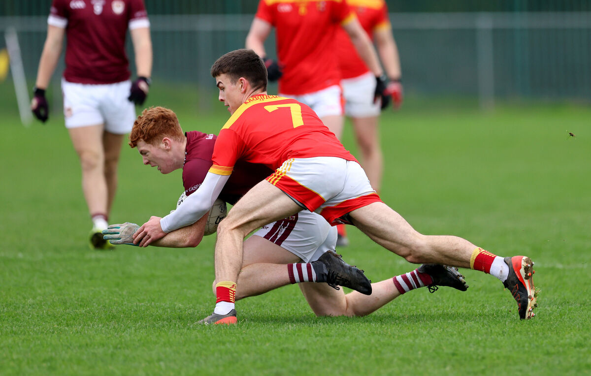  Sam Copps, Mallow, tackles Sam Sheridan, Bishopstown. Picture: Jim Coughlan.