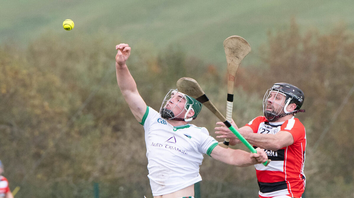 Ballinora's Shane Kingston and Ballincollig's JP Murphy reach for a high ball at Ovens. Picture: Howard Crowdy