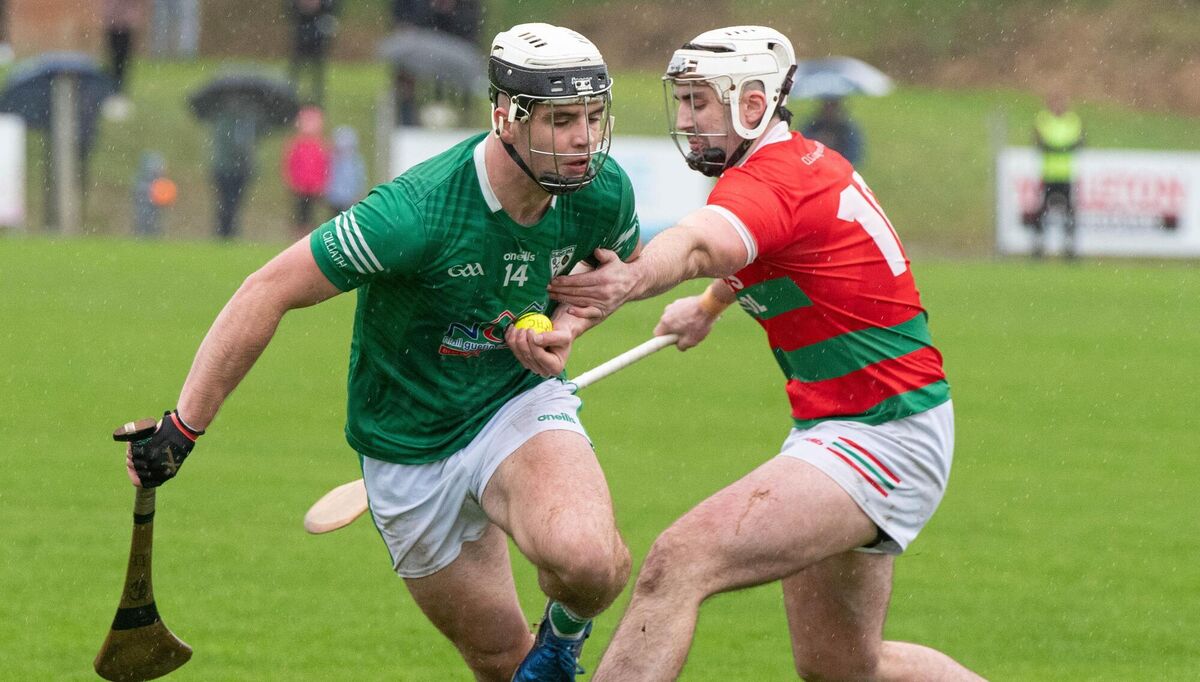 Cormac Murphy of Carraig Na bhFear attempts to hold back Killeagh's Barry Walsh during the East Cork Oil East Cork JAHC final in Castlemartyr. Picture: Howard Crowdy