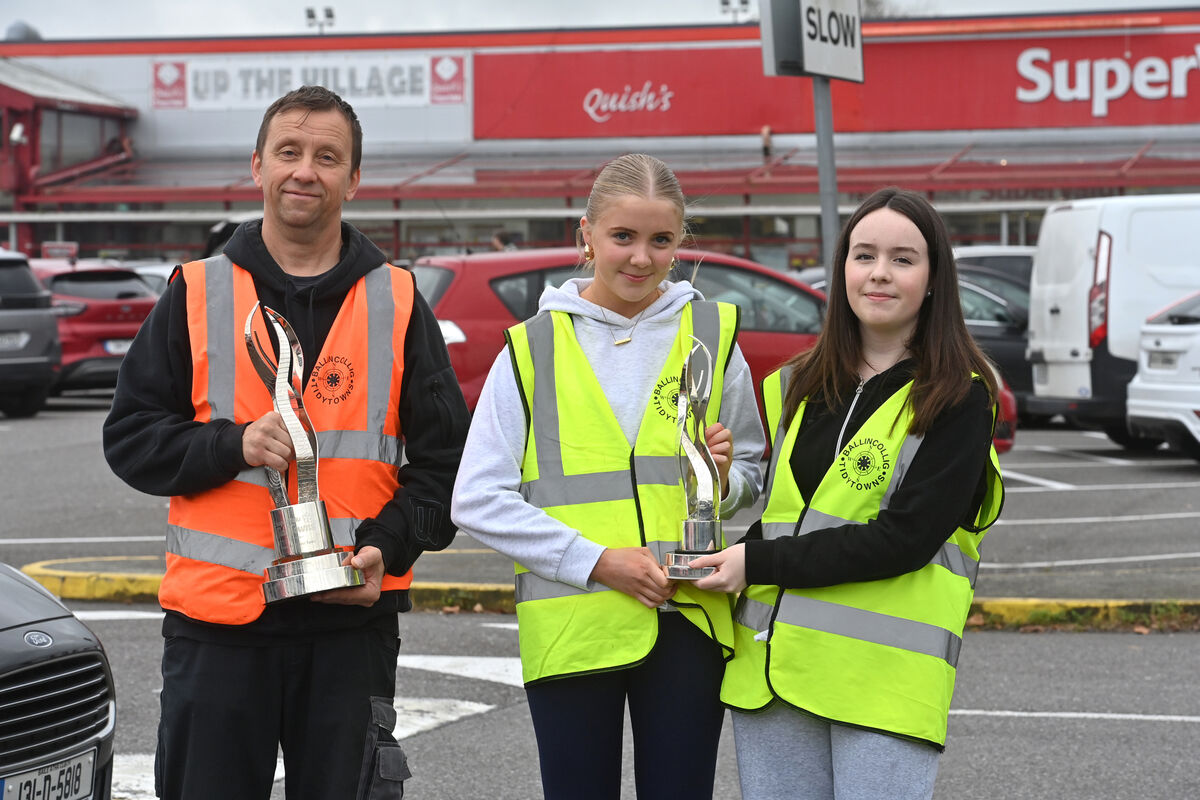  Csaba King with the overall SuperValu Tidy Towns gold medal winner trophy for Ballincollig and TY students Eadaoin O'Connell and Emelia Hallissey with the trophy for best urban centre. Picture Dan Linehan