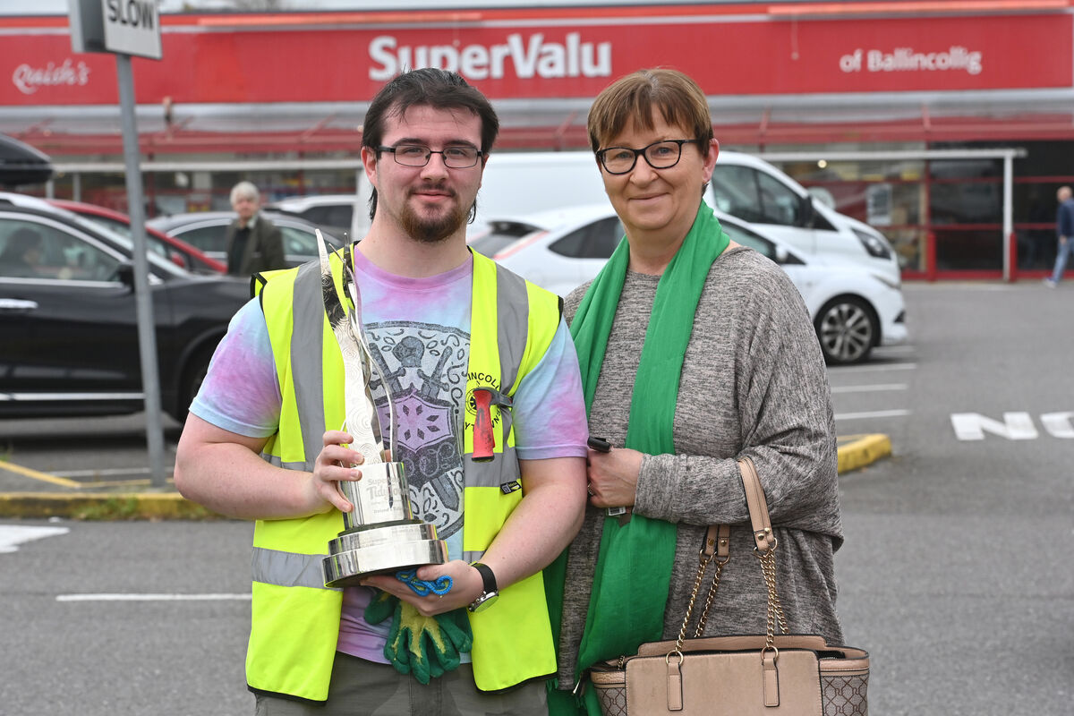 Shane Twomey and his mother Lorna with the overall SuperValu Tidy Towns gold medal winner trophy for Ballincollig .Picture Dan Linehan