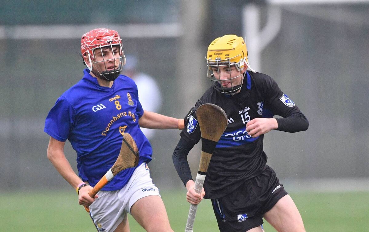 Tom Huggins of Sarsfields is chased by Edmund Burke St Finbarr's. Picture: Tony Noonan Tom Huggins of Sarsfields is chased by Edmund Burke St Finbarr's. Picture: Tony Noonan