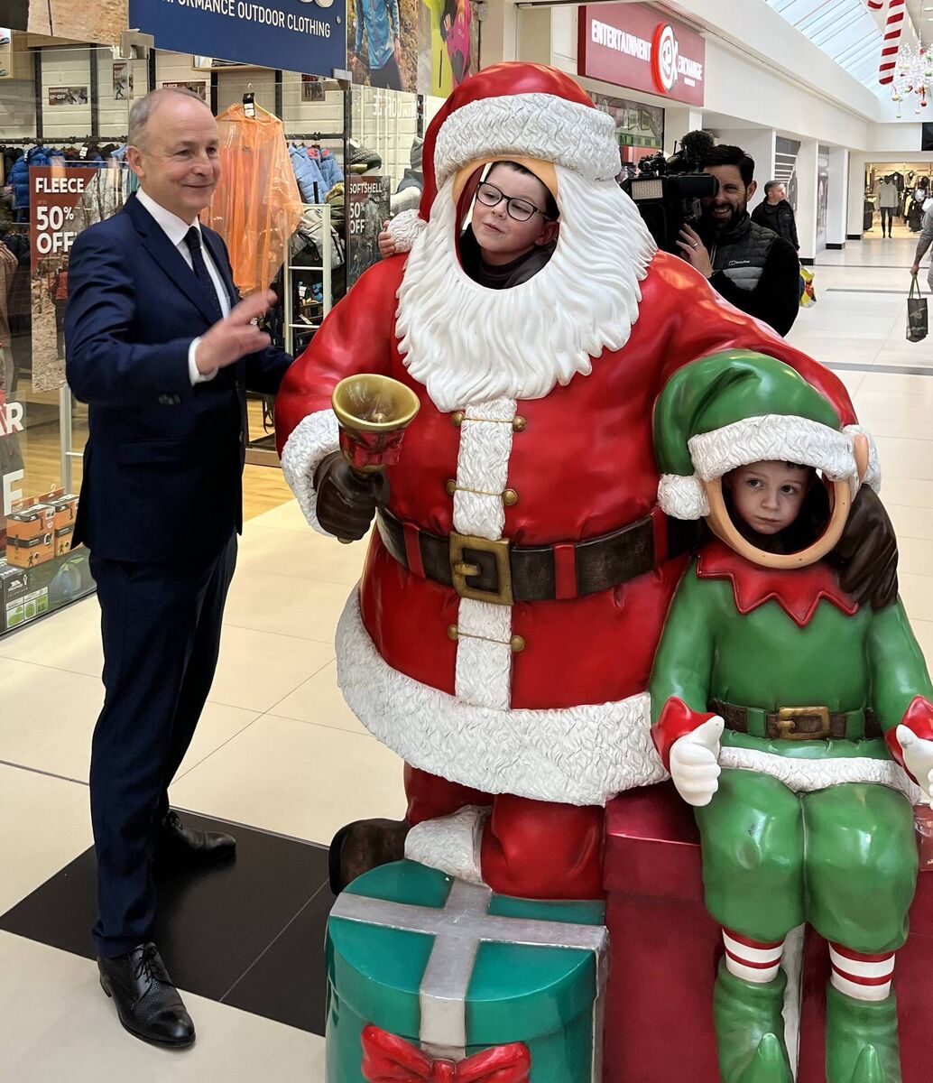 Tánaiste Micheál Martin, canvassingin the Douglas Village Shopping Centre, met Santa and his elf, also known as Art and Ted O'Callaghan. Picture: Donal O'Keeffe