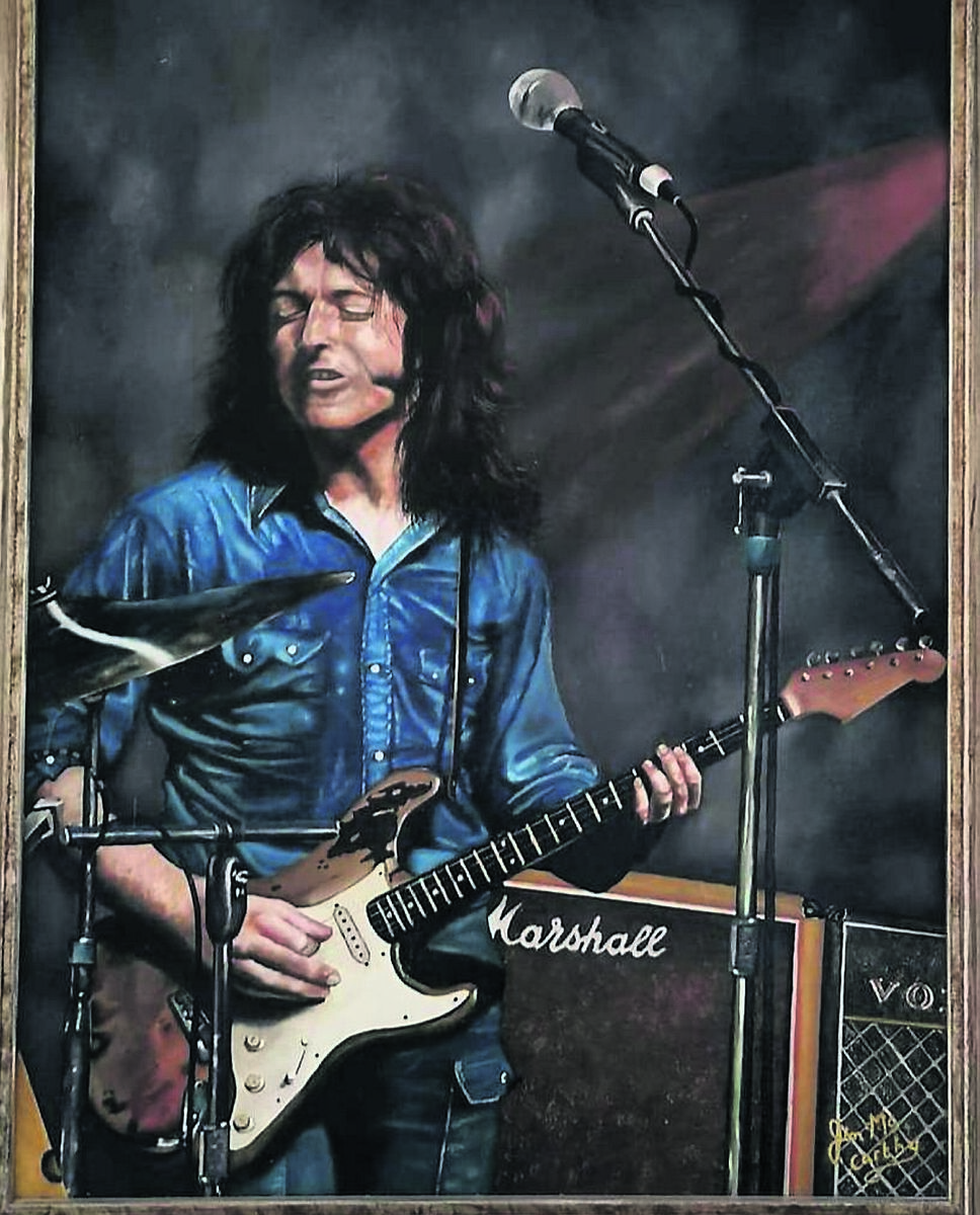 A painting of Rory Gallagher by Cork artist Jim McCarthy.