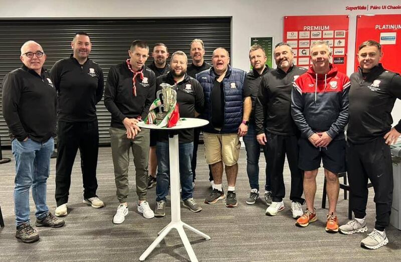 The Watergrasshill management team and backroom team with the PIHC trophy.