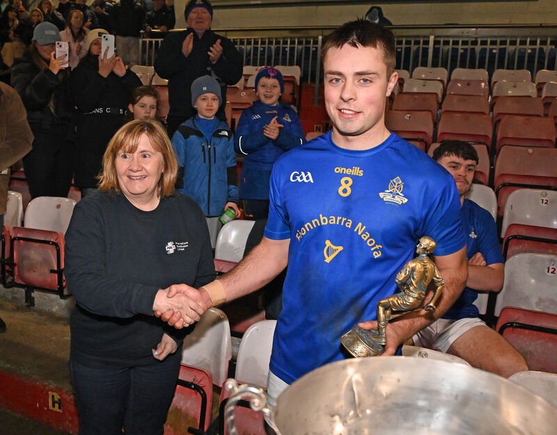 Liz Farr, PharmaCare, presents the Player of the Match award to St Finbarr's William Buckley. Picture: Eddie O'Hare