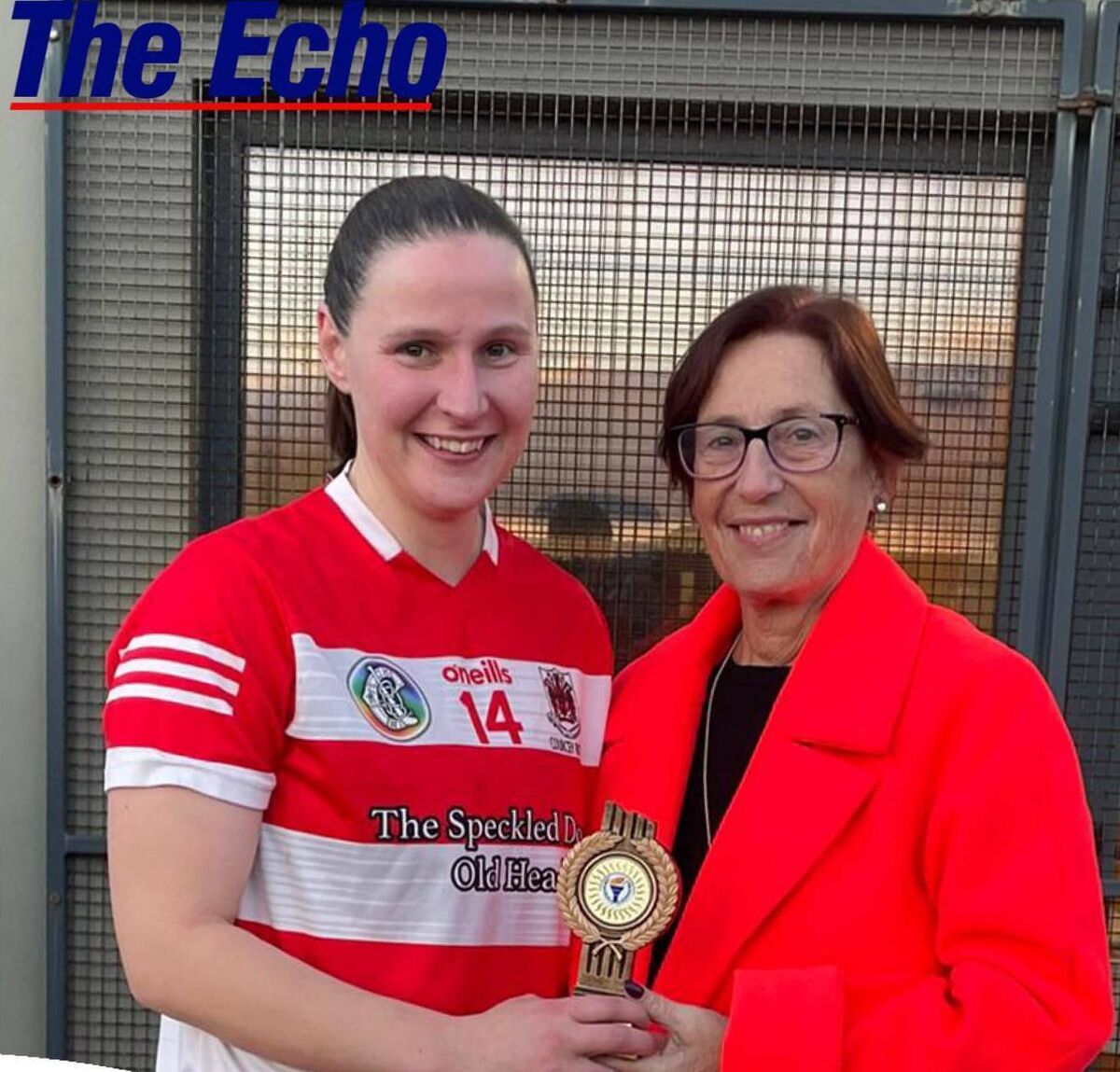 Liz Minehane is presented with The Echo Player Of the Match award by Mairead O'Donovan, chairperson Cork Camogie.