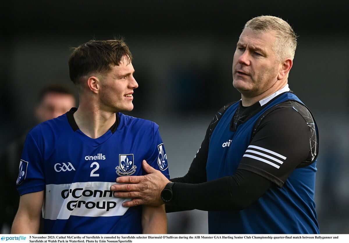 Cathal McCarthy of Sarsfields is consoled by Sarsfields selector Diarmuid O'Sullivan after defeat to Ballygunner last year. Picture: Eóin Noonan/Sportsfile