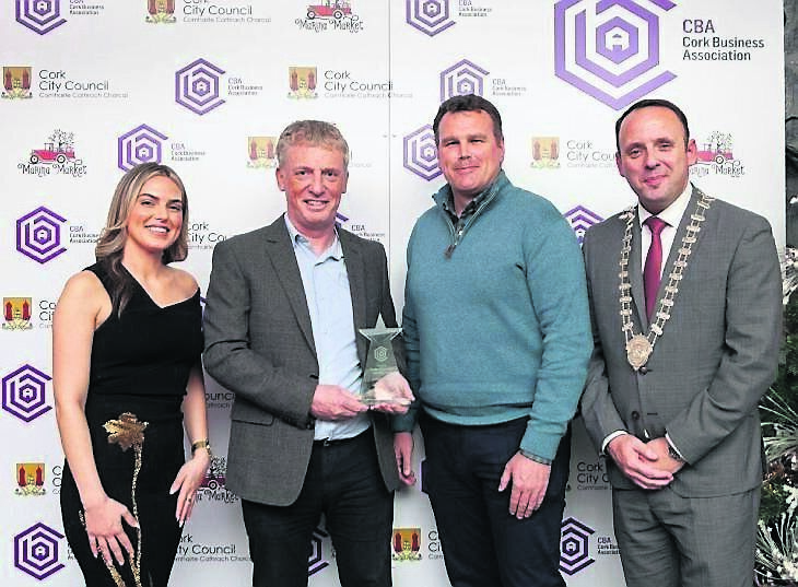 Overall Judges’ Choice award winners for redevelopment of the former Moore’s Hotel, Will Leahy and Conor Nolan of Elliott Group, presented by Maryann Hegarty of Urban Green Private, with Aaron Mansworth. Pic: Diane Cusack