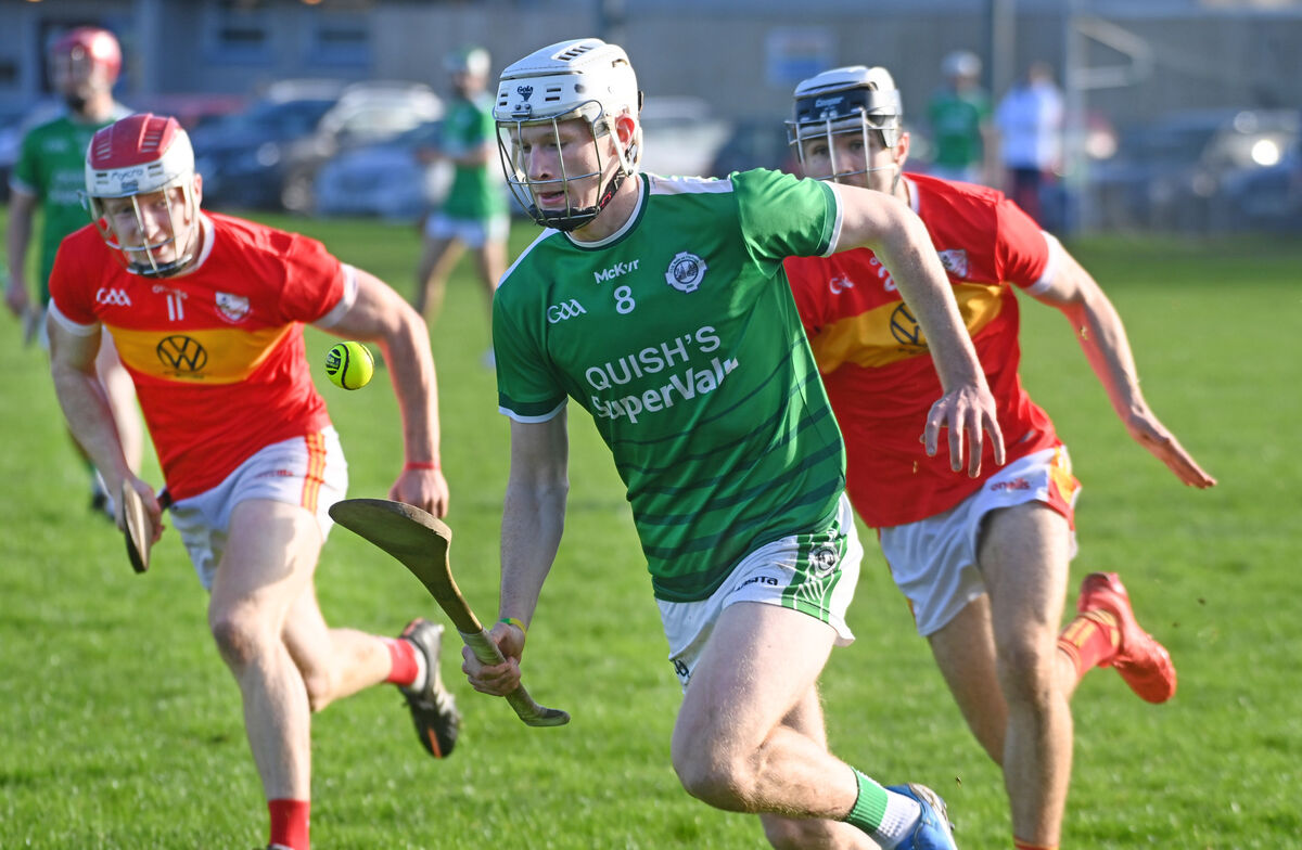 Ballincollig's Pete Kelly racing away from Éire Óg's Brian Thompson and Adam McCarthy. Picture: Eddie O'Hare