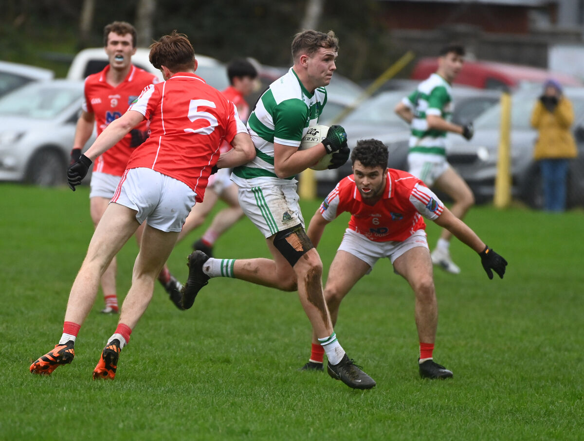 Valley Rovers' David Carthew breaks between Beara's Sean O'Shea and Darragh O'Sullivan. Picture: Eddie O'Hare