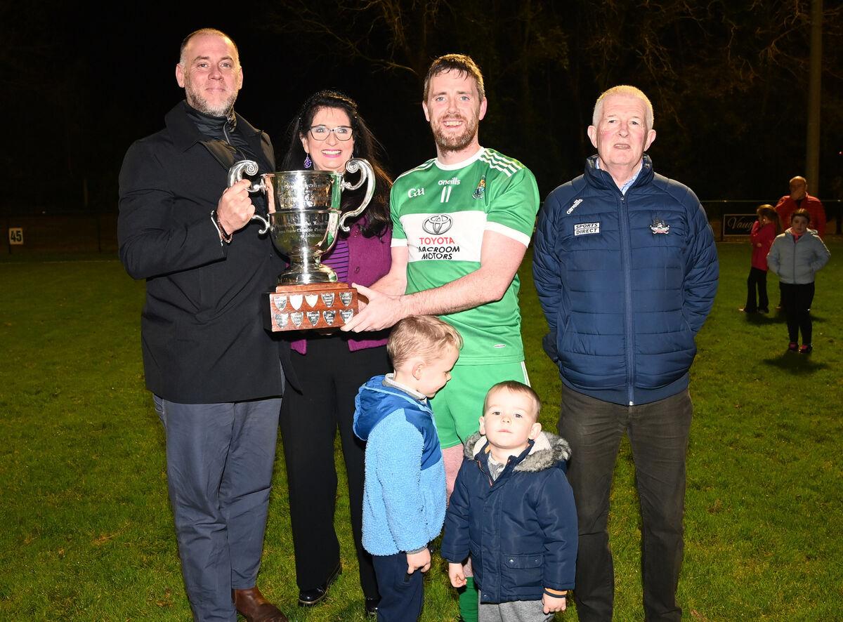 Marian Creedon-Hegarty and Tom Creedon Jnr. present the Tom Creedon cup to Macroom captain Sean Kiely , with Sean's sons Luca and leo and John O'Mahony, Cork county board after defeating Boherbue in the Tom Creedon cup final at Macroom. Picture: Eddie O'Hare