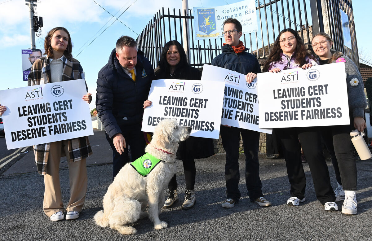 My Canine Companion dog Kora joined the ASTI protest outside Coláiste Eamann Rís, Deerpark, Cork, as teachers demand more fairness for Leaving Certificate students. Unions say that the swift reform of the Leaving Cert examination without proper consultation is of concern to both ASTI and TUI. Picture: Larry Cummins 
                    