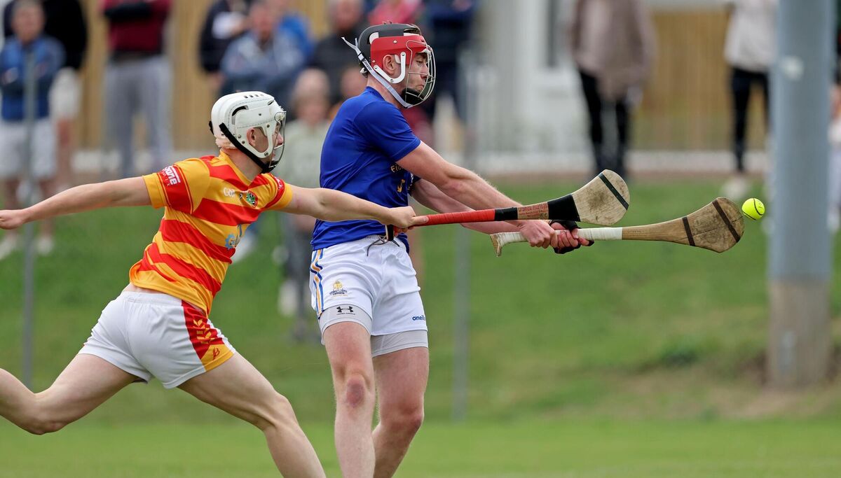 Ethan Twomey, St. Finbarr's, gets his shot away to score the first goal under pressure from Eoghan Collins, Newcestown.Picture: Jim Coughlan. 