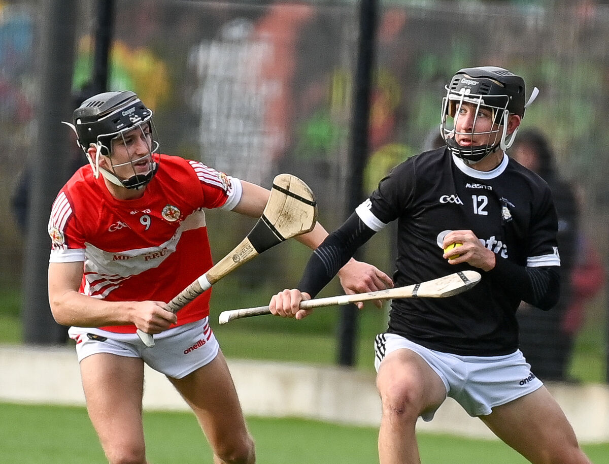 Charlie Hanratty of St Francis College Rochestown keeps possession as Eoghan Fraser of Midleton CBS closes in.