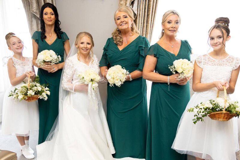 The bride with her maid of honour and bridesmaids, three of her sisters, Catherine, Diann and Martina, and her flower girls, nieces Chloe and Jessica.