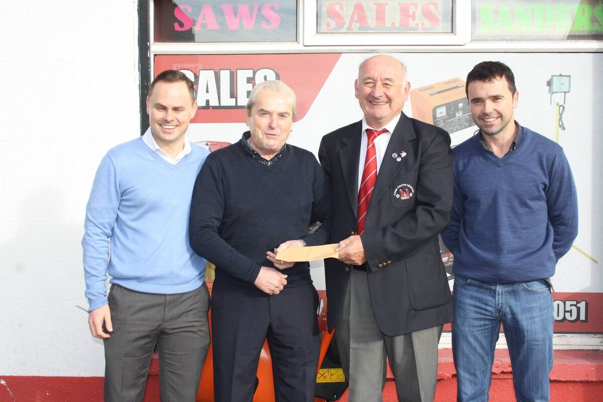 Joe Daly Snr presents a sponsorship cheque to Richard Browne, Treasurer of Cork Youth Leagues, also included is Mark Daly and Joe Daly Jrn.
