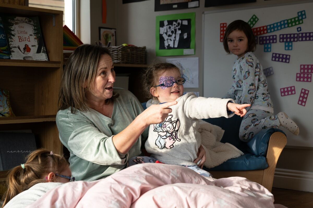 Lee Herlihy with Mai Long having fun at Horizons Montessori during their 21st Annual Pyjama Day for charity.