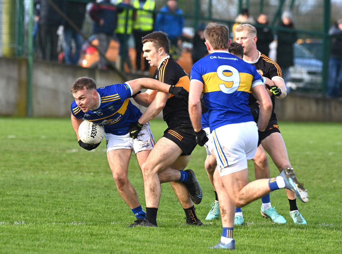 Kilshannig's Darragh O'Sullivan is tackled by Dylan Casey of Austin Stacks. Picture: Dan Linehan