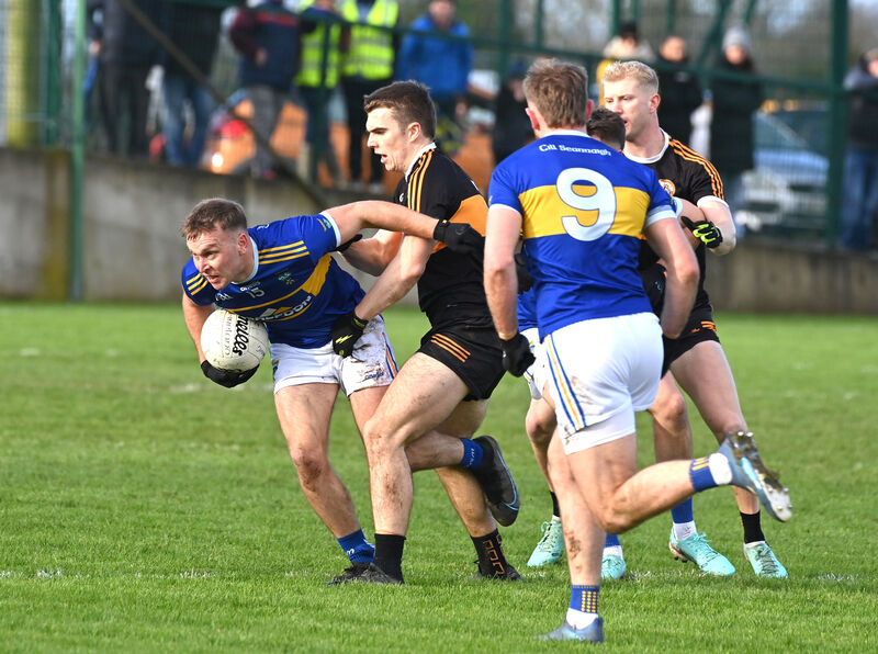 Kilshannig's Darragh O'Sullivan is tackled by Dylan Casey of Austin Stacks. Picture: Dan Linehan