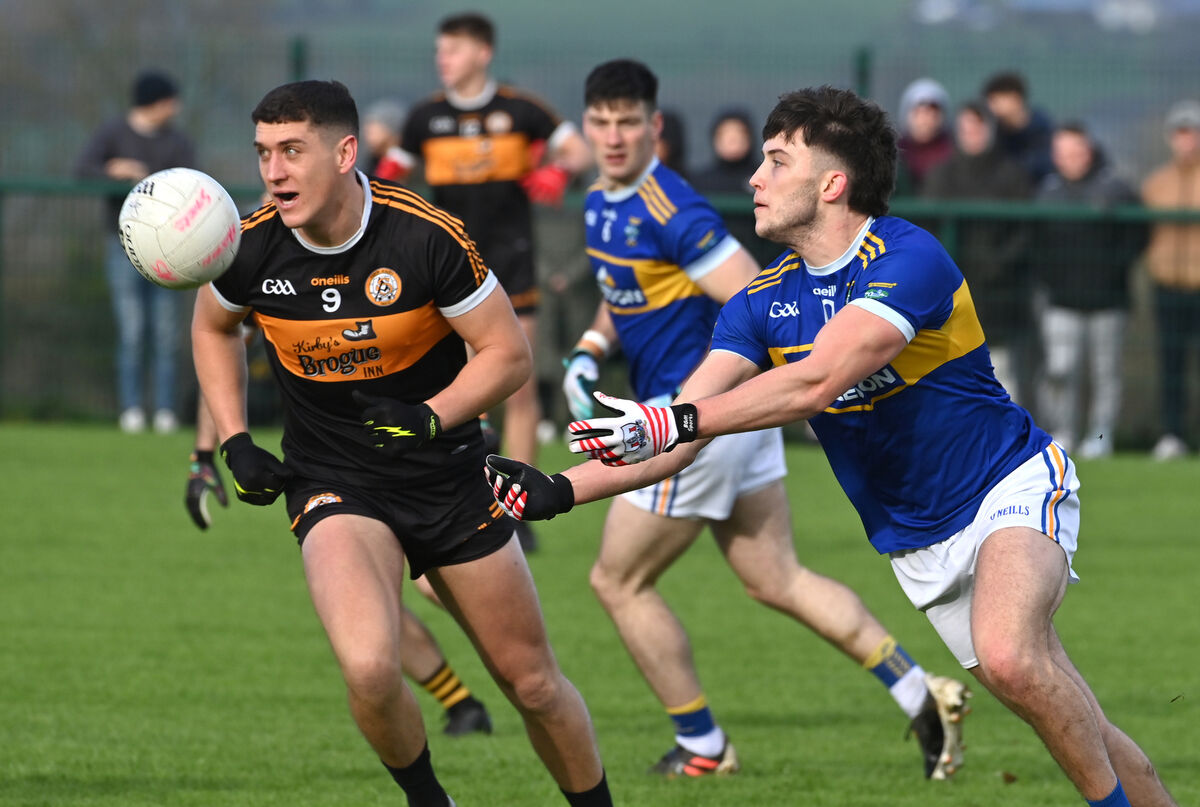 Kilshannig's Shane Murphy gets his pass away watched by Joe O'Connor of Austin Stacks. Picture: Dan Linehan