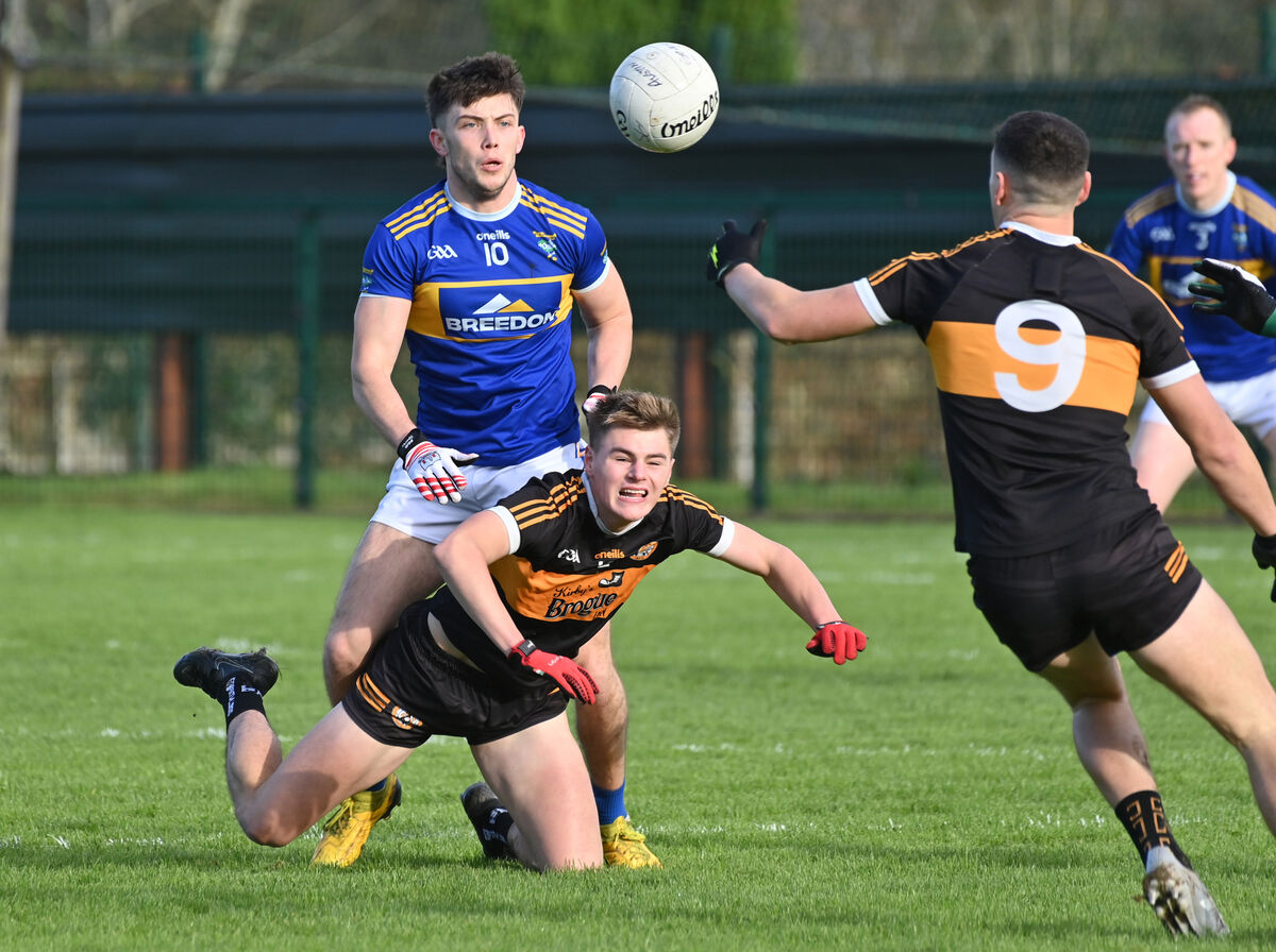  Colin Griffin of Austin Stacks gets his pass away while under pressure from Kilshannig's Shane Murphy. Picture: Dan Linehan