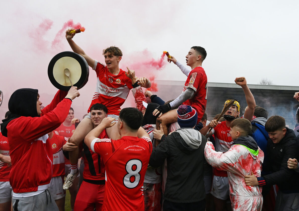 Midleton CBS supporters join players Tom A. Walsh and Sam Ring in celebrations. Picture: Eddie O'Hare