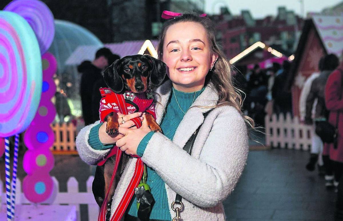 Ciara Hosford from Mayfield with her dog Frank enjoying the Corkmas festive markets and the Santa experience in Emmet Place which is presented by Cork City Council and runs every weekend until December 22. Corkmas continues until December 30. SEE: www.corkmas.ie	Picture: Diane Cusack
                    