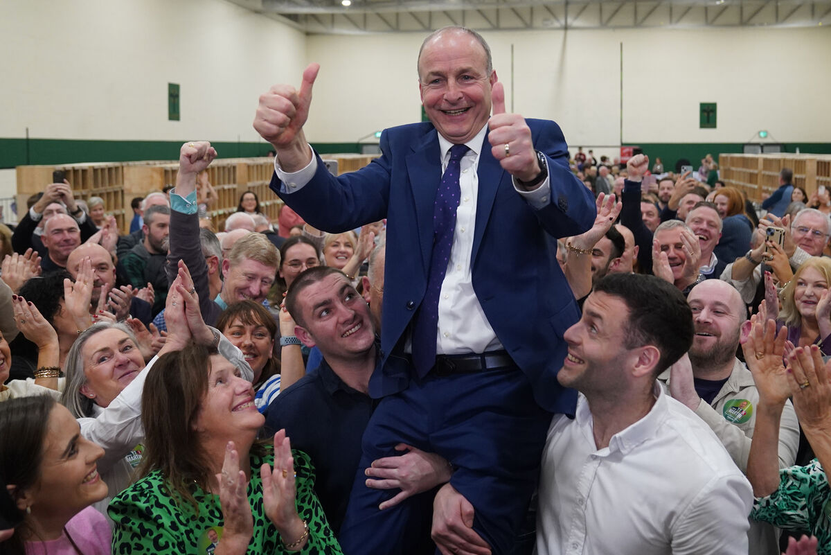Fianna Fáil leader Micheál Martin is hoisted up by his sons Cillian and Micheál Aodh after he was deemed elected in the Cork South Central constituency at the election count centre at Nemo Rangers GAA Club. Fianna Fáil leader Micheál Martin is hoisted up by his sons Cillian and Micheál Aodh after he was deemed elected in the Cork South Central constituency at the election count centre at Nemo Rangers GAA Club.