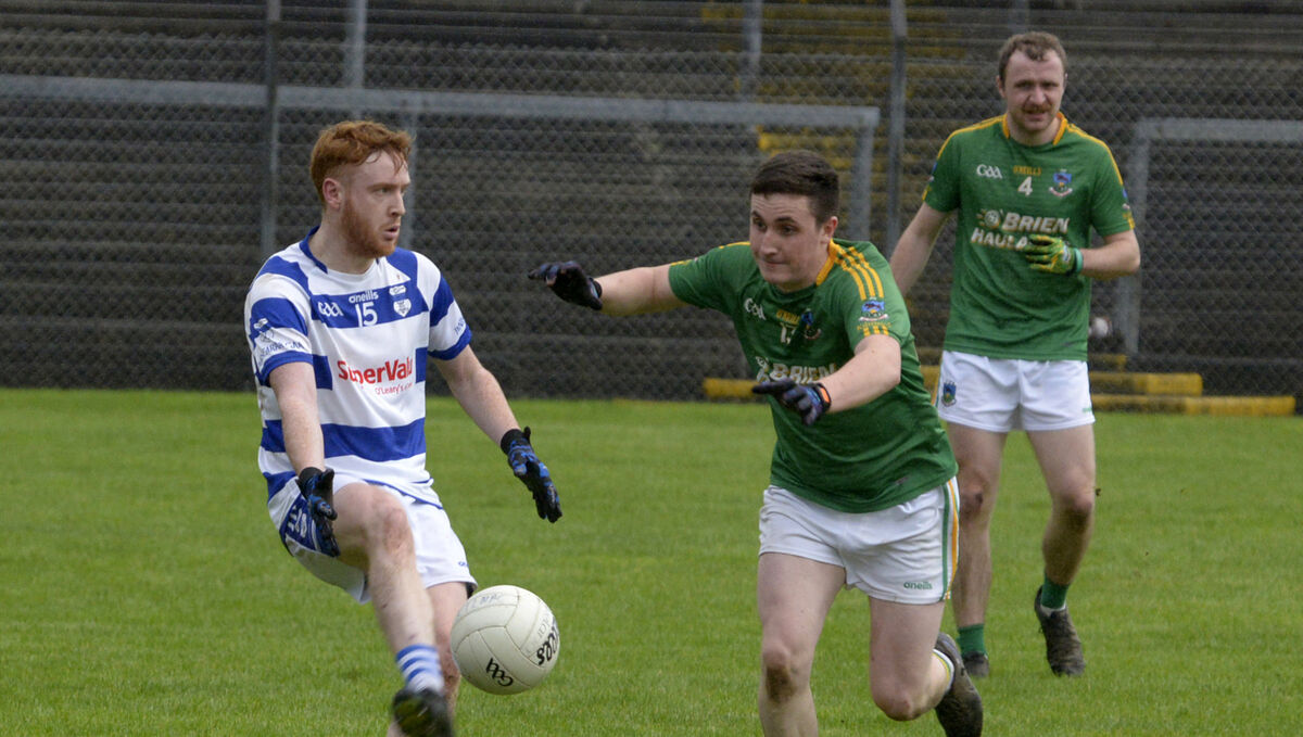 Inniscarra's Dylan O'Sullivan is tackled by Eamon Shanahan of Kilmacabea. Picture: Denis Boyle