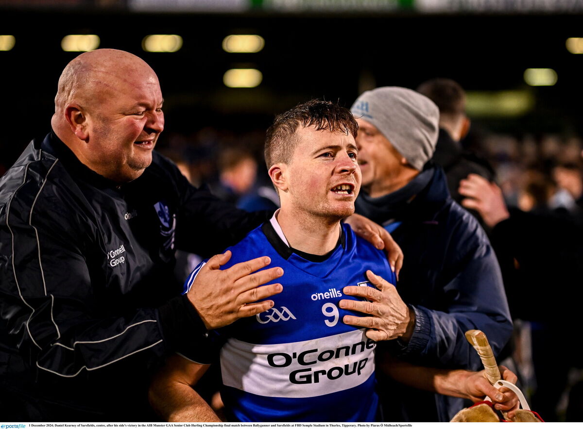 Daniel Kearney of Sarsfields with backroom member Tom Holohan. Picture: Piaras Ó Mídheach/Sportsfile