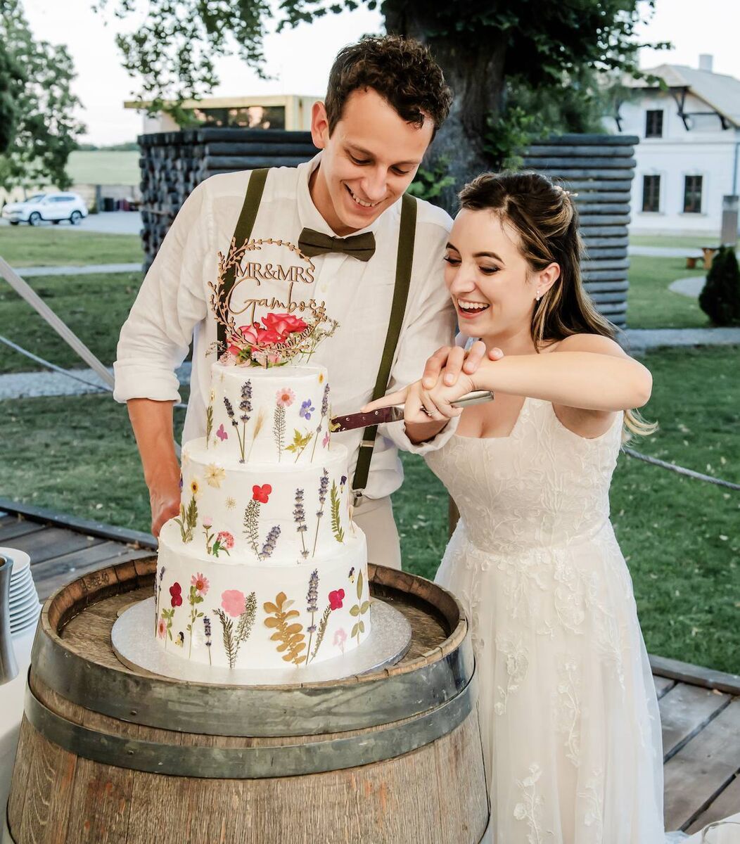 Joni and Tomáš had no idea what their cake would look like until it was brought out to be cut.