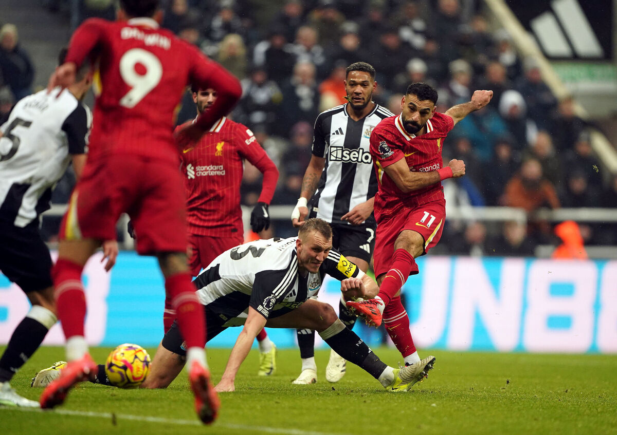 Liverpool's Mohamed Salah scores the side's third goal of the game during the Premier League match at St James' Park, Newcastle Picture: Owen Humphreys/PA Wire.