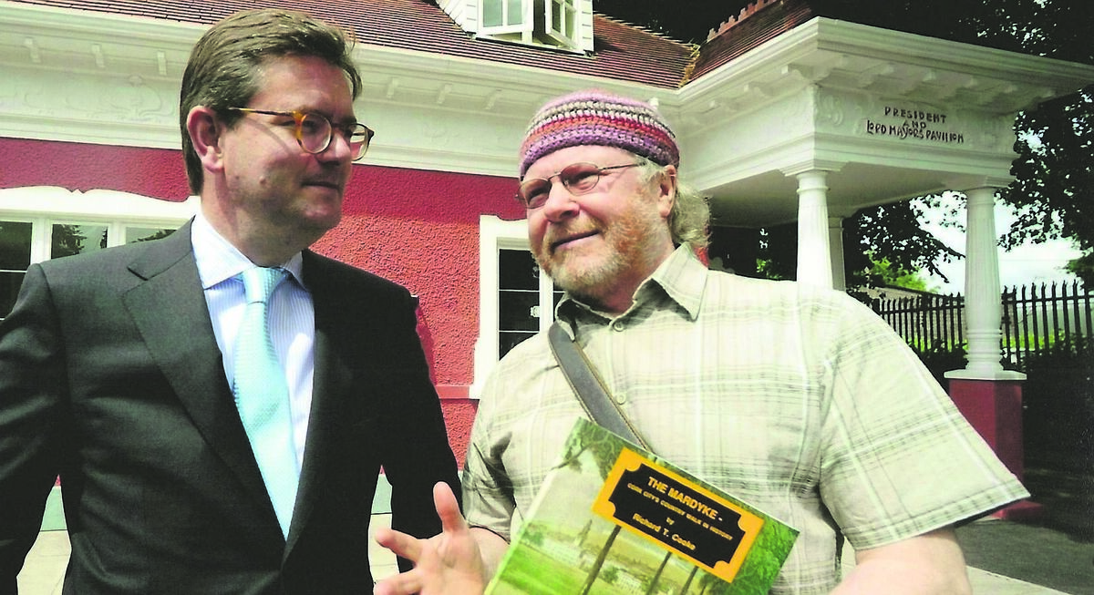 Richard T Cooke in deep conversation with the British Ambassador to Ireland, His Excellency, Julian King, regarding the historical importance of Fitzgerald Park to the people of Cork after presenting the first edition of his book: “The Mardyke – Cork City’s Country Walk in History” at the official opening on June 14, 2011 of the newly refurbished President &amp; Lord Mayor’s Pavilion in Fitzgerald Park, which is now an exhibition centre.