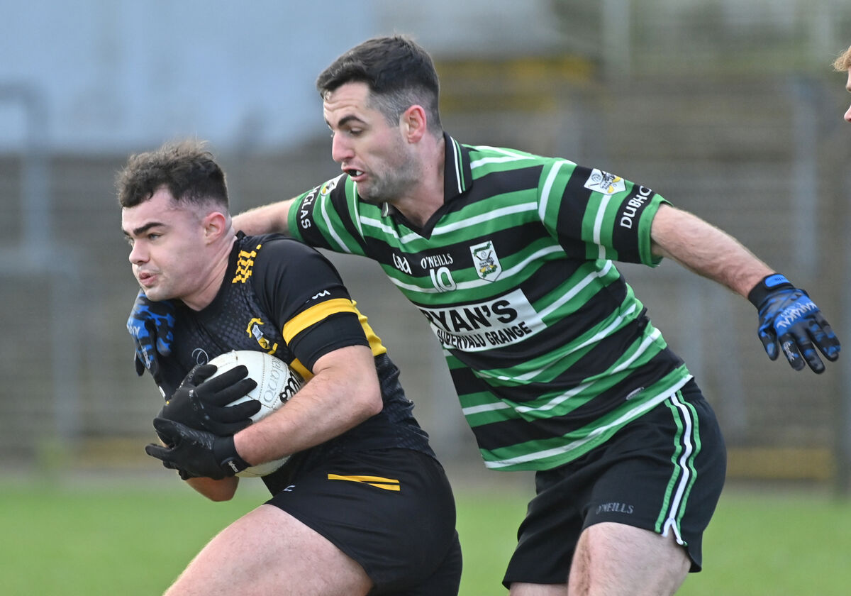  Killan Doyle, Douglas, getting in a tackle on Paul Collins, Goleen. Picture: Dan Linehan
